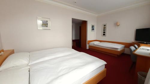 Cama o camas de una habitación en Hotel Promenade