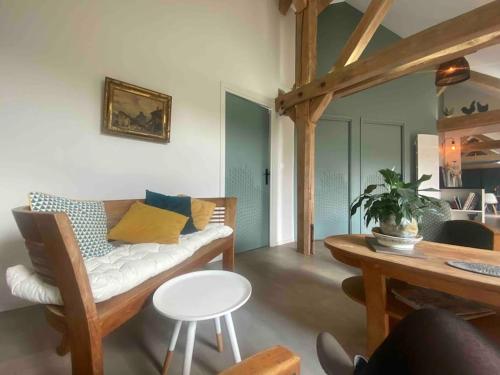 a living room with a couch and a table at Villenouan domaine et gites in Lailly-en-Val