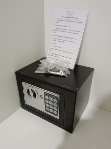 a small microwave with a box on top of it at Baan Plaifah Khao Yai Hotel in Khao Yai