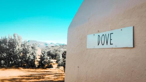 a sign on the side of a building that says love at Fossil Hills in McGregor