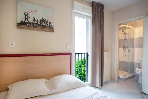 Ένα ή περισσότερα κρεβάτια σε δωμάτιο στο Appart Hotel Corte HR