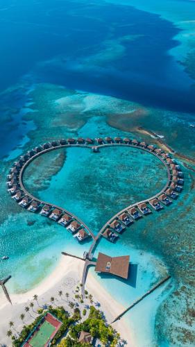an aerial view of a resort in the ocean at Radisson Blu Resort Maldives with 50 percent off on Sea Plane round trip 03 nights & above in Fenfushi