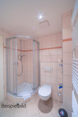 a bathroom with a shower and a toilet at Strandläufer Classic 105 in Granzow