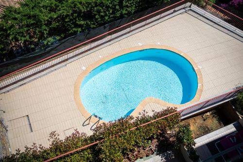 an overhead view of a swimming pool on a building at Moonstone Home - Seaview, Parking, WiFi in Vallecrosia
