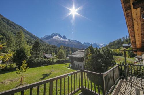 a balcony with a view of a mountain at Chalet Du Croz 1er - Happy Rentals in Chamonix