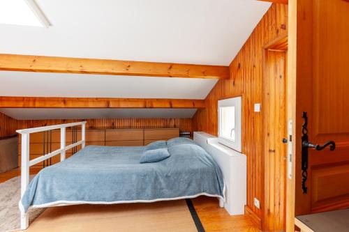 a bedroom with a bunk bed and wooden walls at Pleine nature in Six-Fours-les-Plages