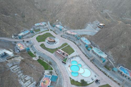 an aerial view of a water park with a water slide at Dibba Mountain Park Resort in Fujairah