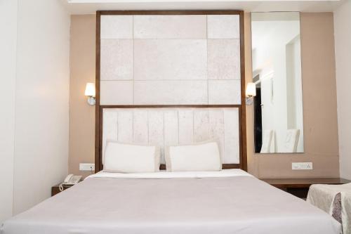 Katil atau katil-katil dalam bilik di Hotel Executive Silver Inn, Aurangabad