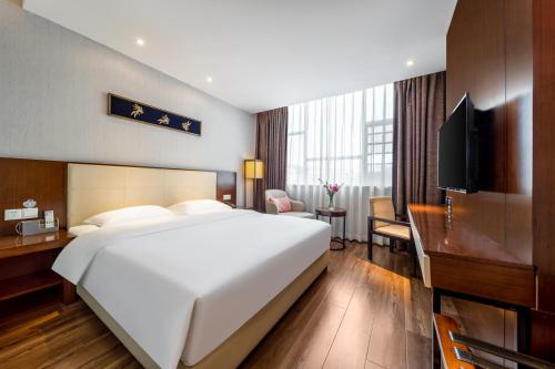 Postel nebo postele na pokoji v ubytování Milton Hotel
