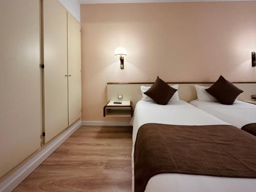 Ein Bett oder Betten in einem Zimmer der Unterkunft Andorra Palace