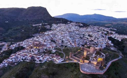 an aerial view of a town in the mountains at La Casa Rosales in Alora