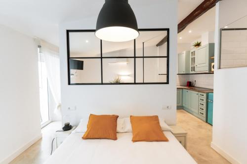 Katil atau katil-katil dalam bilik di Loft Alguer en Ametlla de Mar