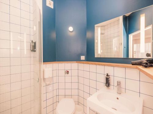 a bathroom with a toilet and a sink and a mirror at ibis Styles Deauville Villers Plage in Villers-sur-Mer