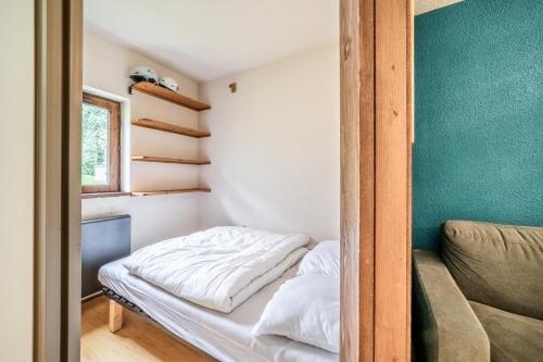 En eller flere senge i et værelse på Le Cozy Tétras