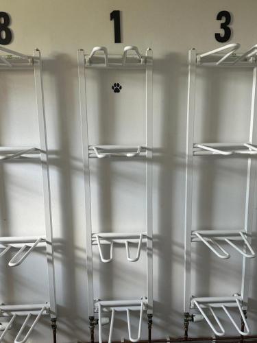 a bunch of glass shelves with numbers on the wall at Hotel U Kabinky in Janske Lazne