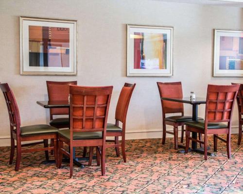 a group of chairs and a table in a room at Comfort Suites McAlester in McAlester