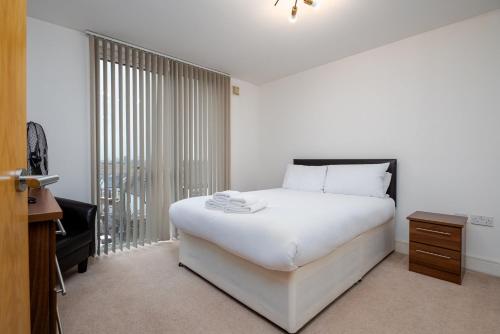 Кровать или кровати в номере GuestReady - Urban Living in Wimbledon