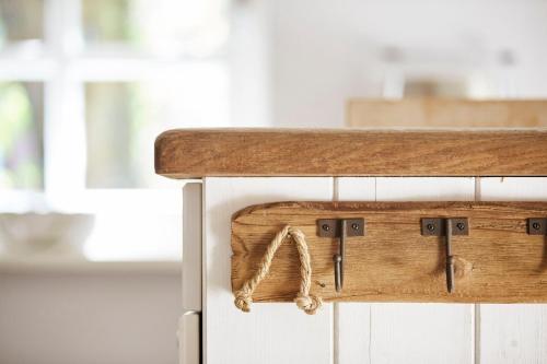 a wooden counter top with a wooden drawer at Haus Augenblick in Utersum