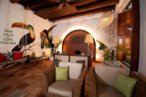 a living room with two chairs and a table at Hotel Bantu by Faranda Boutique, a member of Radisson Individuals in Cartagena de Indias