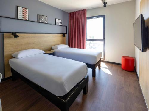 Postel nebo postele na pokoji v ubytování Ibis Marseille Marignane Technopole