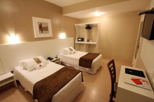 Katil atau katil-katil dalam bilik di Hotel Curi Executive