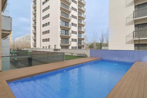 a swimming pool on the roof of a building at GuestReady - Sant Adrià de Besòs Hideaway in Barcelona