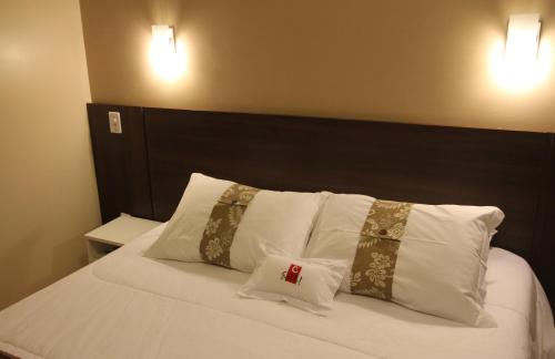 Katil atau katil-katil dalam bilik di Hotel Curi Executive