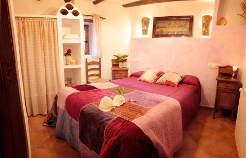 Ένα ή περισσότερα κρεβάτια σε δωμάτιο στο Romantic house for 2 or 4 people with jacuzzi