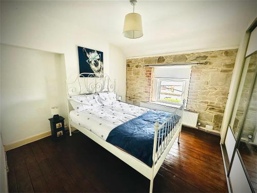 Ένα ή περισσότερα κρεβάτια σε δωμάτιο στο Coastal Charm