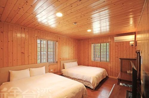Posteľ alebo postele v izbe v ubytovaní 清境 百里莊園 Baili Manor Cing Jing