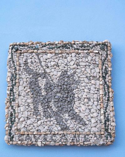 a mosaic of rocks on a blue background at DIMORA BORDIN Luxury Aparthotel Animali ammessi in Nettuno