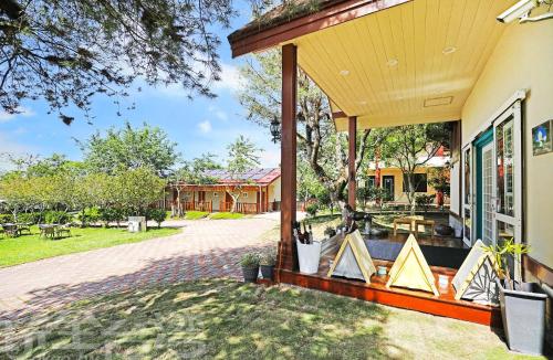 an outdoor patio of a house with a porch at 清境 百里莊園 Baili Manor Cing Jing in Renai