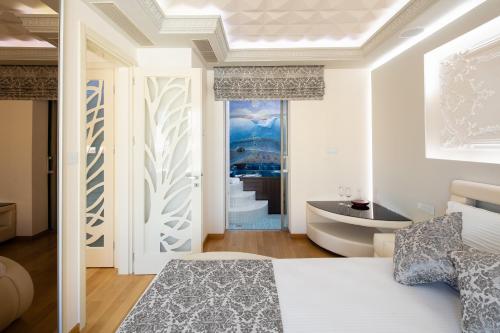 Postel nebo postele na pokoji v ubytování De President Suite, DeMaNi President Suites