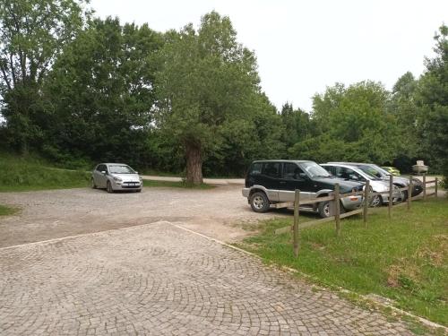 a group of cars parked in a parking lot at Isola della Cona - Riserva naturale Foce dell'Isonzo in Staranzano