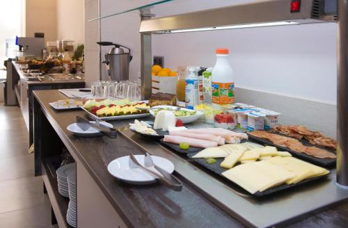 a counter in a kitchen with some food on it at Hotel Marfil in San Antonio