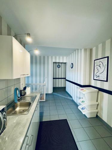 a kitchen with a sink and a counter top at Willa Medom in Władysławowo