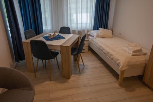 Кровать или кровати в номере Apartmani Rosica