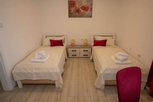 Кровать или кровати в номере Apartmani Rosica