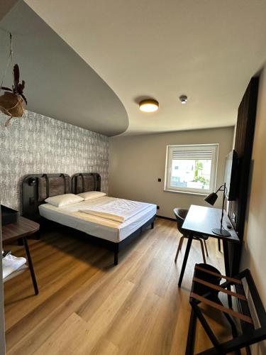 Giường trong phòng chung tại Ratshotel - City Aparthotel Aalen