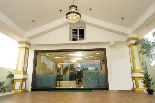 a large building with a large glass doorway at Hotel Dusk and Dawn in Rāmeswaram