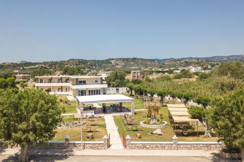 an aerial view of a park with trees and buildings at Al Mare Apartments in Afantou
