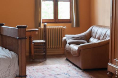 a living room with a couch and a chair at Rosario in Bever