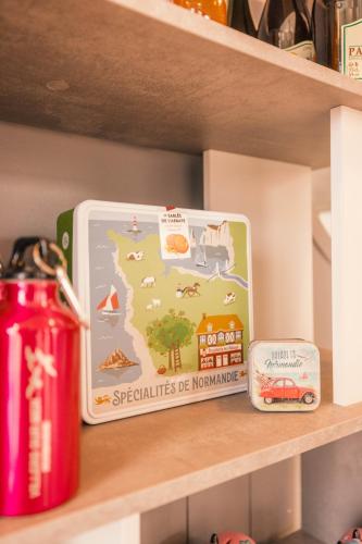 a toy on a shelf with a sign on it at ibis Styles Deauville Villers Plage in Villers-sur-Mer