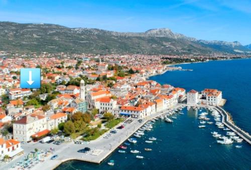 an aerial view of a city with a harbor at Apartman Mir in Kaštela