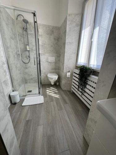 a bathroom with a shower and a toilet at Casa L'Aquila in Como