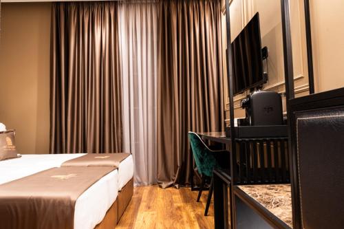 TV o dispositivi per l'intrattenimento presso Art Gallery Boutique Hotel