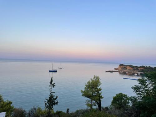 a view of a large body of water with two boats at Deep Blue Villas in Vasilikos