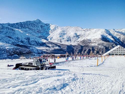 a group of people standing on a snow covered mountain at Apartment Tenuta Rucas by Interhome in Montoso