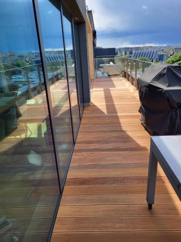 a balcony with a view of a building at Luxury Penthouse Rzeszów in Rzeszów