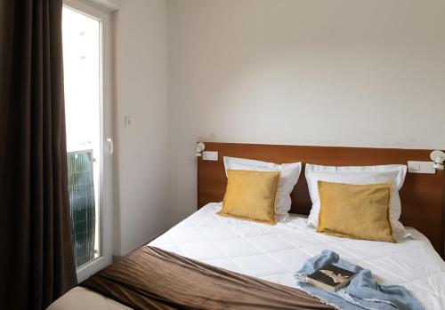 Ένα ή περισσότερα κρεβάτια σε δωμάτιο στο Appart Hotel Corte HR